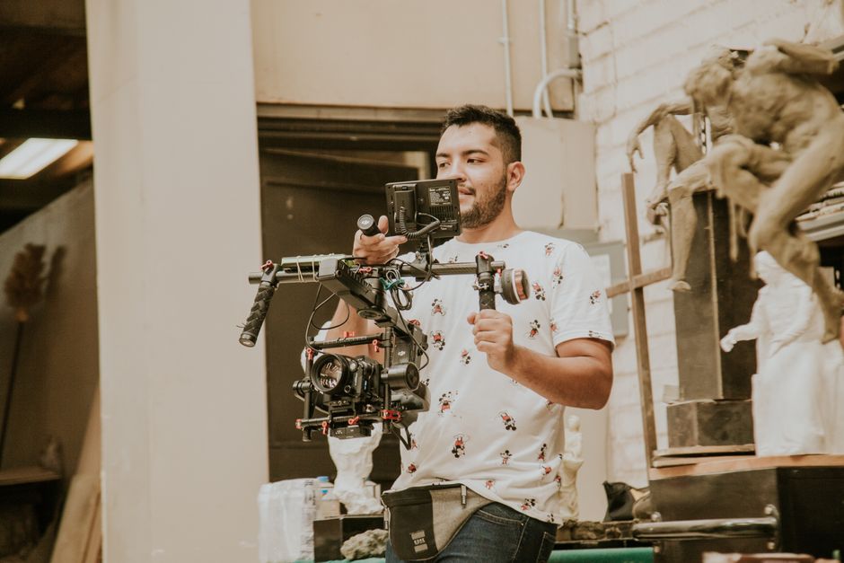 Dedicated wedding videographer working on location capturing a couple